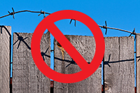 Example of a fence with barbed wire.