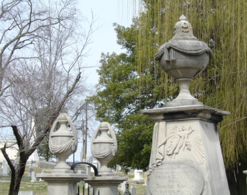 Cemetery urns and willow tree