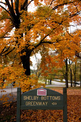 Shelby Bottoms Greenway sign under fall foliage