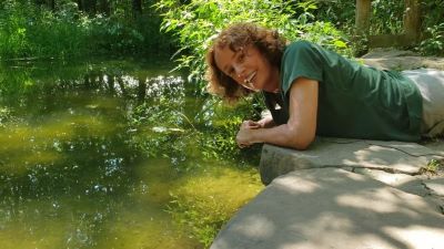 Naturalist exploring pond