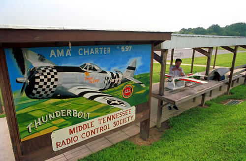 AMA Charter #597 Thunderbolt Middle TN Radio Control Society; man and radio-controlled airplane
