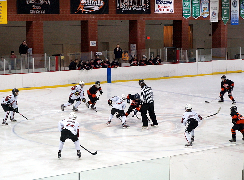 youth hockey game; opening face off