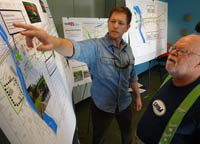 photo of planner and community member looking at map