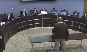 Man Speaking at Podium to Members of the Planning Commission