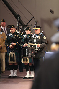 team members with bagpipes