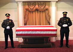 team members beside casket