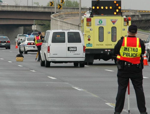 Metro Police and TDOT workers at interstate accident scene